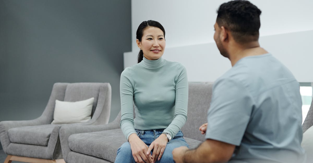 A modern and bright clinic reception area with a smiling receptionist assisting a patient, showcasing an efficient and welcoming environment.